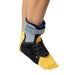 Side view of the Brace Direct Recovery Ankle Brace, worn by a model.