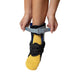 Woman demonstrating how to fit the Brace Direct Recovery Ankle Brace.