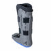 Rear view of the Brace Direct Tall Lightweight Medical Full Shell Walking Boot with Air Pump, isolated on white.