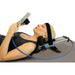 Side view of a woman reclining while operating the Brace Direct Cervical Neck Traction Unit.