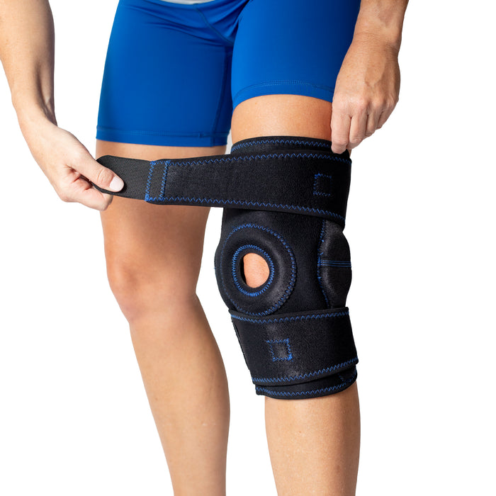 Woman demonstrating how to fit the Brace Direct Hinged Knee Brace with Patella Stabilizer.
