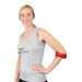 A smiling model demonstrates the fit of the red Brace Direct Compression Brace for Tennis Elbow.