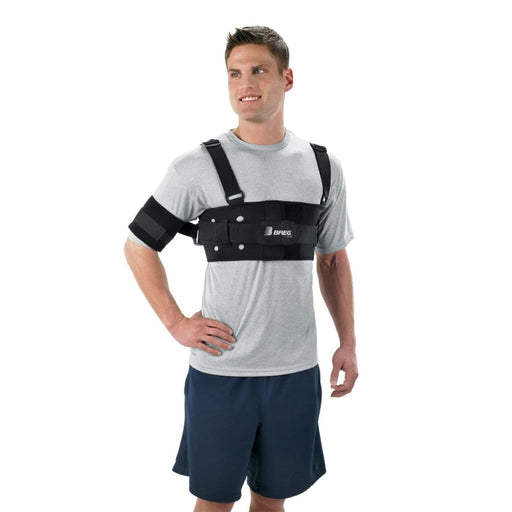 A smiling model demonstrates the fit of the Breg Shoulder Stabilizer, by Brace Direct.