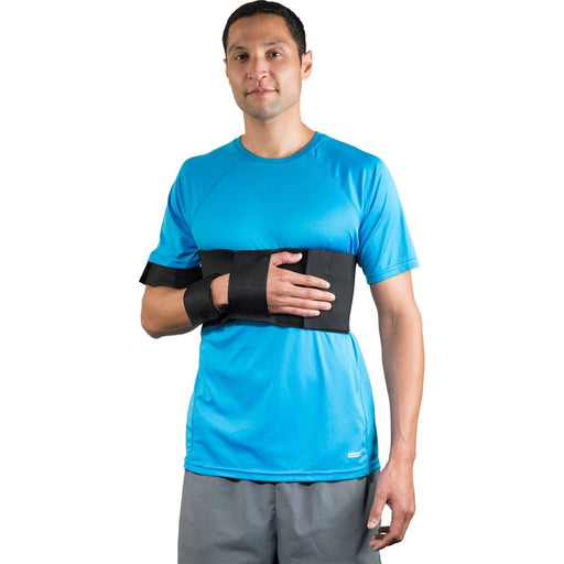 A smiling model demonstrates the fit of the Breg Straight Shoulder Immobilizer, by Brace Direct.