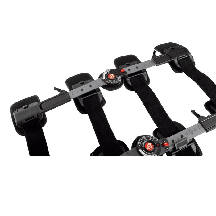 Close-up of the Breg T Scope Premier Post-Op ROM knee brace's telescoping bars, isolated on white.