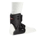 Right side view of the Breg Ultra CTS Ankle Recovery Support Brace, worn by a model.