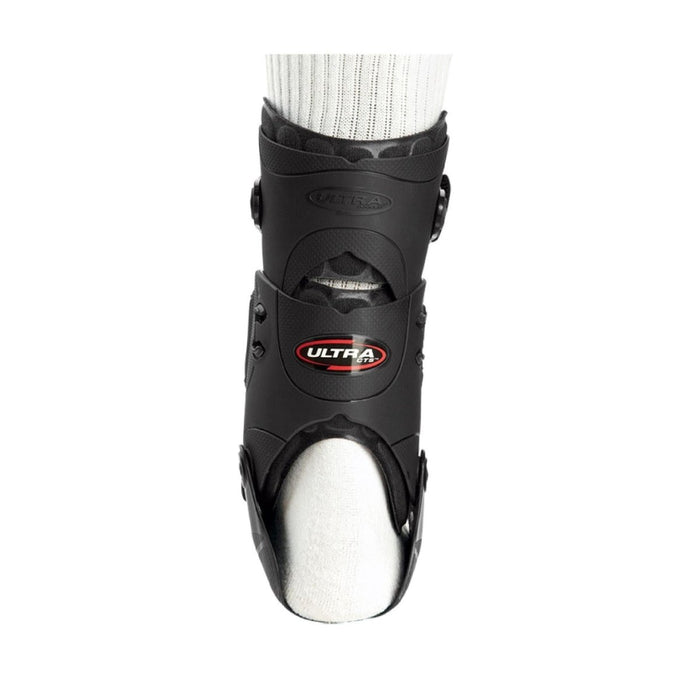 Rear view of the Breg Ultra CTS Ankle Recovery Support Brace with the detachable PerformaFit upright, worn by a model.