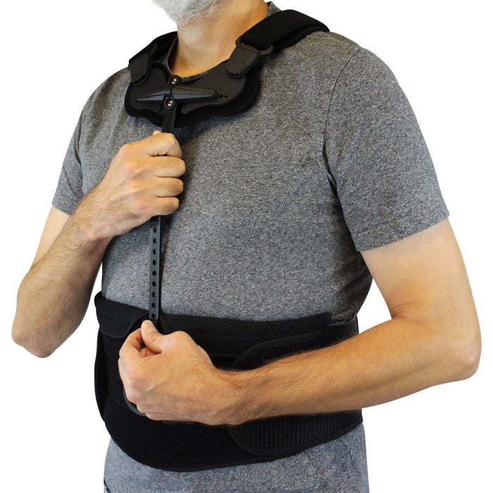 Side close-up of the Cybertech Full Back TLSO Brace for Spinal Support by Brace Direct, worn by a model.