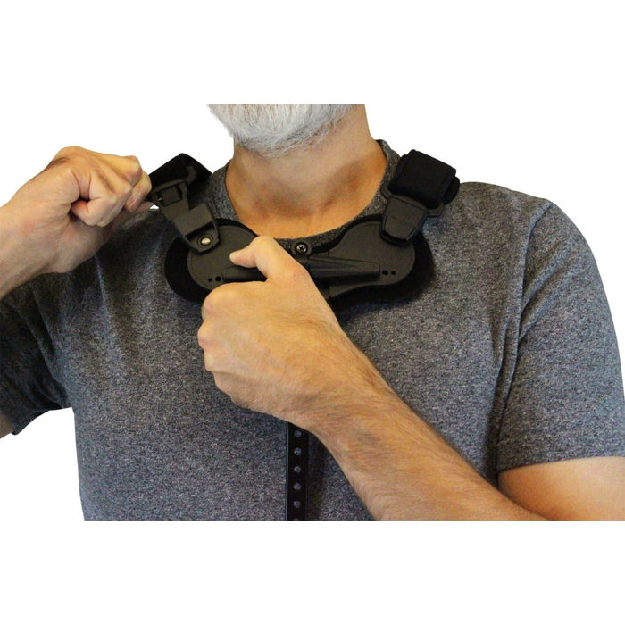 A male model demonstrates how to fit the Cybertech Full Back TLSO Brace for Spinal Support, by Brace Direct.