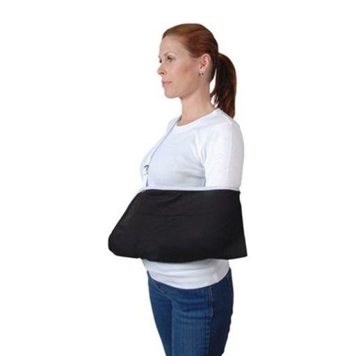 A female model demonstrates the fit of the Ossur Arm Sling with Buckle Closure, by Brace Direct.