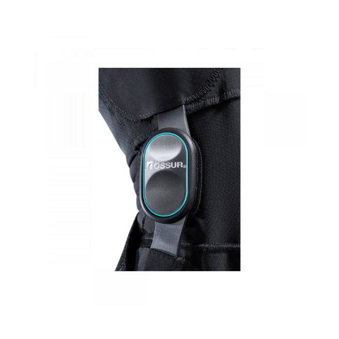 Close-up of the Ossur Formfit OA Ease Knee Osteoarthritis Brace's low profile hinge, isolated on white.